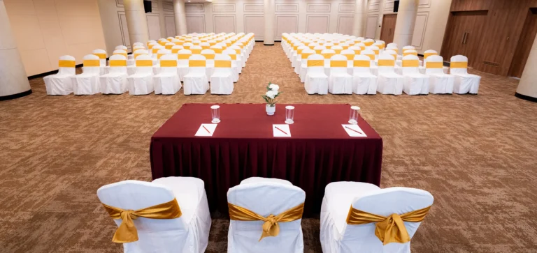 Regalia set theatre-style for a conference at Regent Club, Whitefield